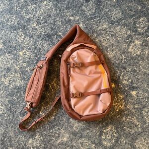 Patagonia pink Sling Backpack with Yellow Logo Accent